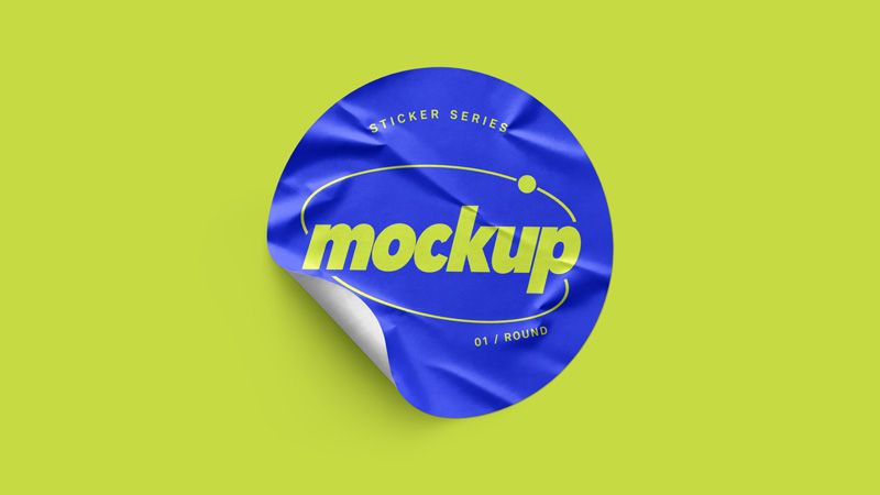 Wrinkled round sticker mockup with blue artwork, lime lettering, and a curled edge on a lime background
